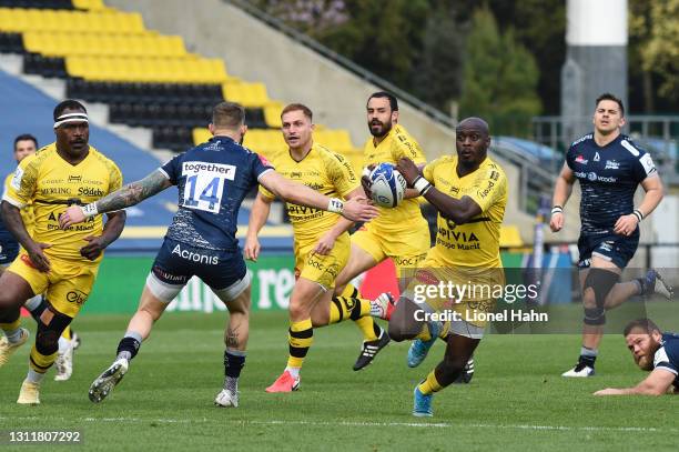 Raymond Rhule of La Rochelle runs through to score their third try during the Quarter Final Champions Cup match between La Rochelle and Sale Sharks...