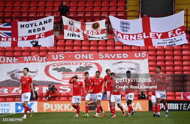 Alex Mowatt of Barnsley FC celebrates with teammates after scoring their team's first goal during the Sky Bet Championship match between Barnsley and...