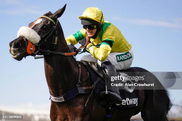 David Bass riding Happygolucky clear the last to win The Betway Handicap Chase at Aintree Racecourse on April 10, 2021 in Liverpool, England....