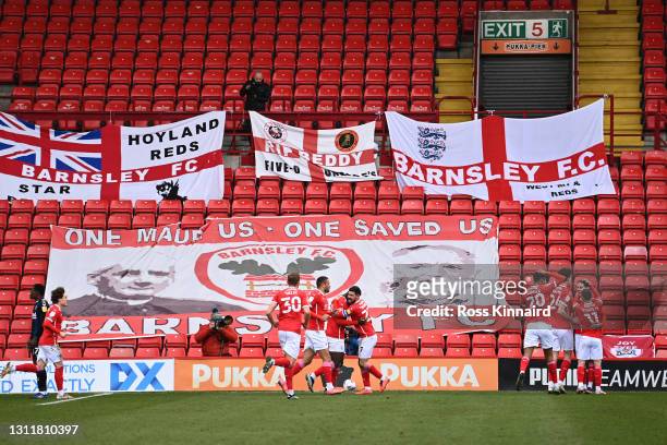 Daryl Dike of Barnsley FC celebrates with teammates after scoring their team's second goal during the Sky Bet Championship match between Barnsley and...