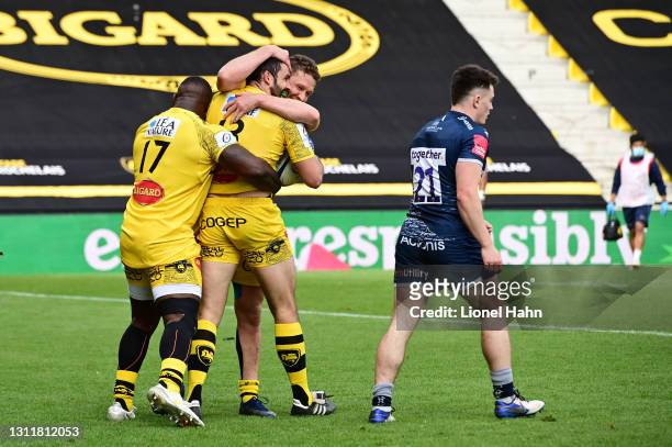 Geoffrey Doumayrou of La Rochelle celebrates with teammates after scoring their fifth try during the Quarter Final Champions Cup match between La...