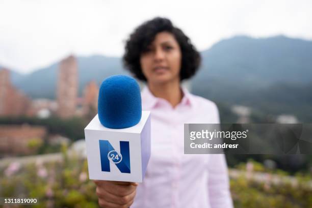 tv reporter outdoors interviewing a person - pov concepts - tv journalists stock pictures, royalty-free photos & images