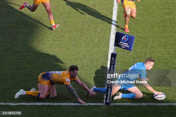 Jordan Larmour of Leinster scores their second try under pressure from Stuart Hogg of Exeter Chiefs during the Heineken Champions Cup Quarter Final...