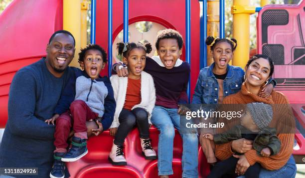 multi-racial family with five children on playground - family with five children stock pictures, royalty-free photos & images