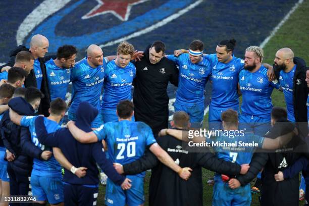 Leinster players and staff huddle on pitch following victory in the Heineken Champions Cup Quarter Final match between Exeter Chiefs and Leinster at...