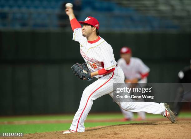 Pitcher Junichi Tazawa of Wei Chuan Dragons pitches at the top of the 10th inning during the CPBL game between Rakuten Monkeys and Wei Chuan Dragons...