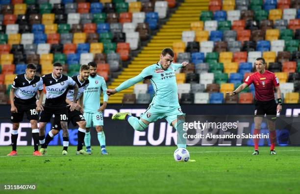 Andrea Belotti of Torino FC scores their side's first goal from the penalty spot during the Serie A match between Udinese Calcio and Torino FC at...