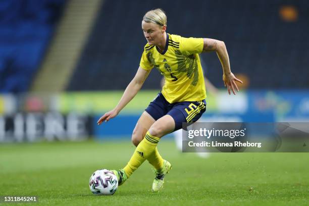 Nilla Fischer of Sweden runs with the ball during the Women's International Friendly match between Sweden and United States at Friends arena on April...