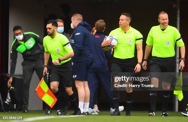 Assistant Referee Bhupinder Gill makes their way out for the start as Fourth Official Sukhvir Gill looks on during the Sky Bet Championship match...