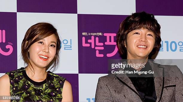 South Korean actors Kim Ha-Neul and Jang Keun-Suk smilss during a press conference for "You're My Pet" at Lotte Cinema on November 2, 2011 in Seoul,...