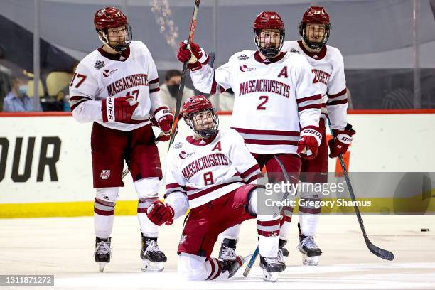 Bobby Trivigno of the Massachusetts Minutemen celebrates with his teammates after scoring a goal against the St. Cloud St. Huskies during the third...