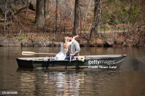 Two people kiss on a rowboat in Central Park amid the coronavirus pandemic on April 10, 2021 in New York City. After undergoing various shutdown...