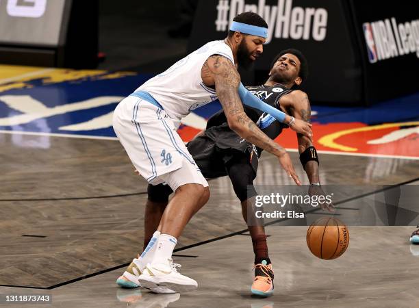 Markieff Morris of the Los Angeles Lakers is called for an flagrant offensive foul as he collides with Kyrie Irving of the Brooklyn Nets in the...