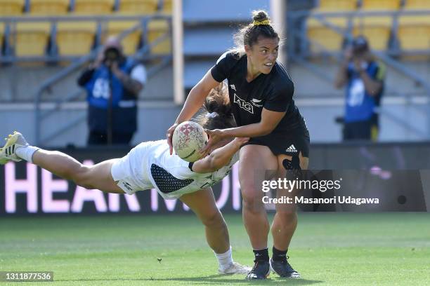Theresa Fitzpatrick of the Black Ferns Sevens Black is tackled during the Sevens match between the Black Ferns Sevens Black and the Black Ferns...