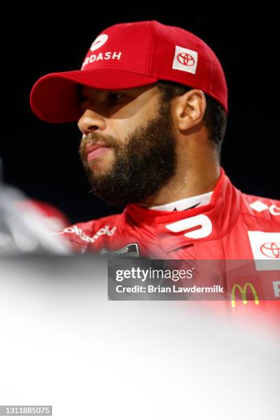 Bubba Wallace, driver of the DoorDash Toyota, waits on the grid prior to the NASCAR Cup Series Blue-Emu Maximum Pain Relief 500 at Martinsville...