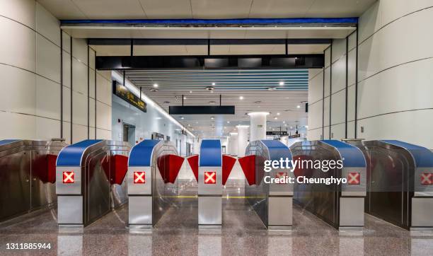 railway station entrance gate in qingdao jiaodong airport - torniquete imagens e fotografias de stock