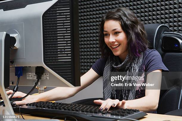 girl playing games on desktop computer - arts express yourself 2009 stock pictures, royalty-free photos & images