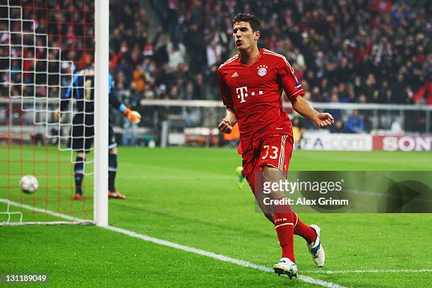 Mario Gomez of Muenchen celebrates his team's second goal during the UEFA Champions League group A match between FC Bayern Muenchen and SSC Napoli at...
