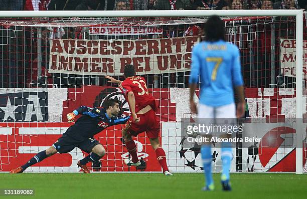 Mario Gomez of Bayern Muenchen scores his second goal against Morgan de Sanctis goalkeeper of Napoli during the UEFA Champions League Group A match...