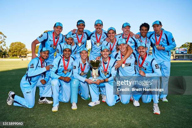 Players celebrate victory with the trophy during the 2021 Marsh One Day Cup Final match between New South Wales and Western Australia at Bankstown...