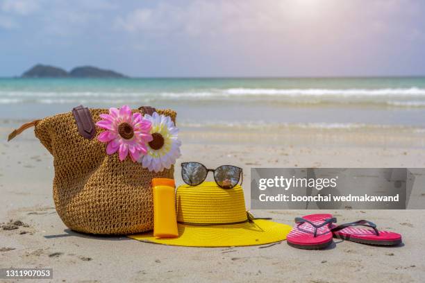 sea and beach background with blue sky and woman on beach and bag - cream colored purse fotografías e imágenes de stock