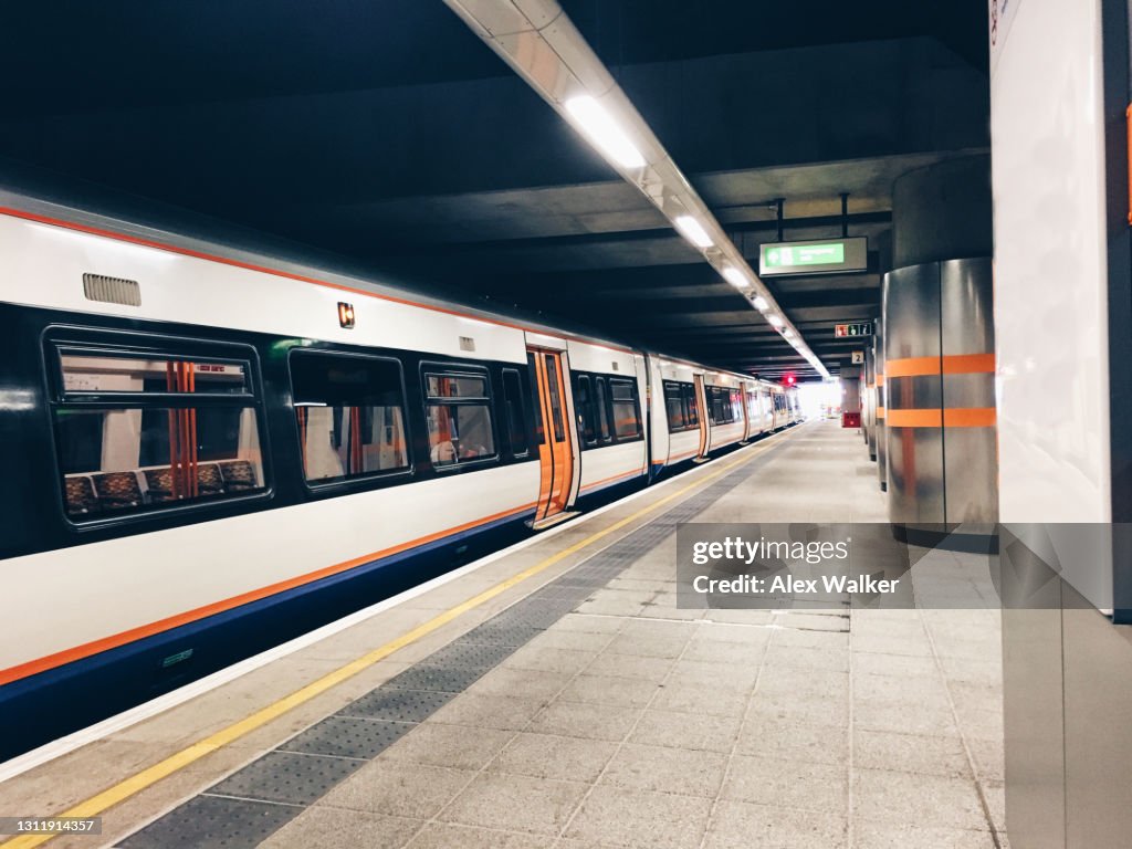 Commuter train in covered station platform