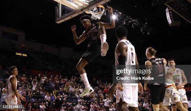 Justin Simon of the Hawks reacts after a slam dunk during during the round 13 NBL match between the Illawarra Hawks and the Cairns Taipans at WIN...