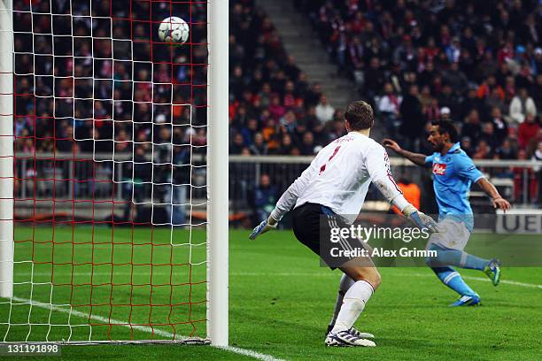 Federico Fernandez of Napoli scores his team's second goal against goalkeeper Manuel Neuer of Muenchen during the UEFA Champions League group A match...