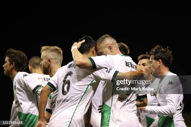 Besart Berisha embraces teammate Tomoki Imai during the A-League match between the Wellington Phoenix and Western United FC at WIN Stadium, on April...