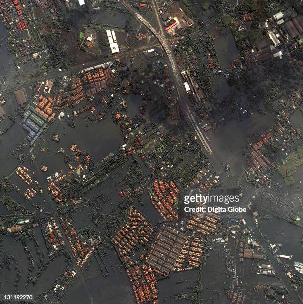 In this satellite view, a stretch of highway shows cars parked to avoid floodwaters, on October 24, 2011 in Bangkok, Thailand. Thailand is...