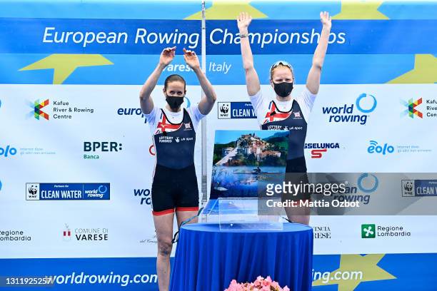 Helen Glover and Polly Swann of Great Britain celebrate on the podium after winning gold in the Women's Pair Final A during Day Three of the European...
