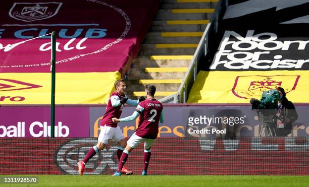 Matej Vydra of Burnley celebrates with Matthew Lowton after scoring their team's first goal during the Premier League match between Burnley and...