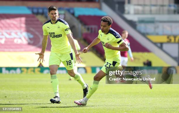 Jacob Murphy of Newcastle United celebrates with Federico Fernandez after scoring their team's first goal during the Premier League match between...