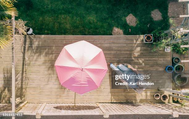 an aerial view of a suburban english garden - stock photo - parasols stockfoto's en -beelden