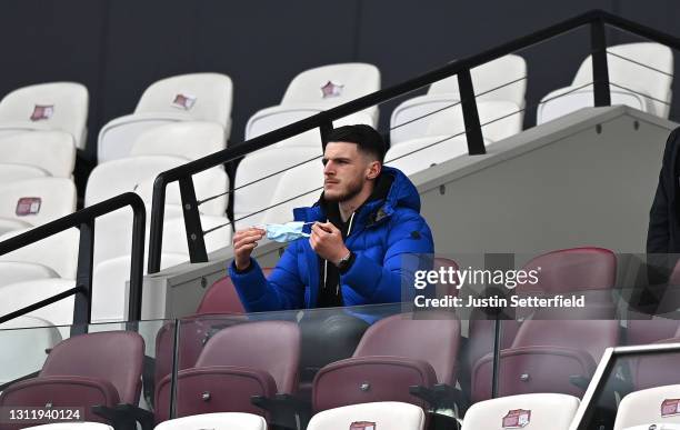 Declan Rice of West Ham United looks on from the bench during the Premier League match between West Ham United and Leicester City at London Stadium...