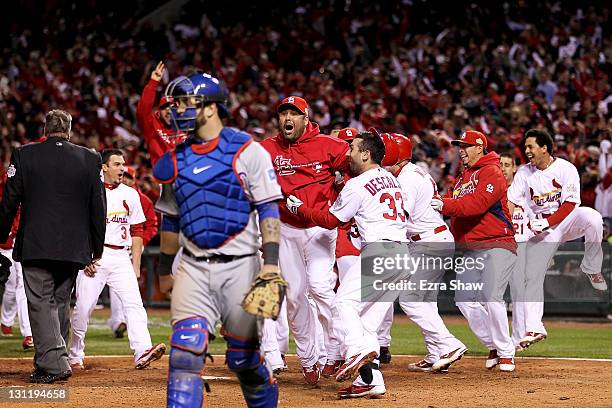 Gerald Laird of the St. Louis Cardinals celebrates after David Freese hits a walk off solo home run in the 11th inning to win Game Six of the MLB...