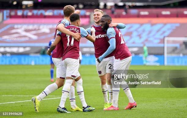 Jarrod Bowen of West Ham United celebrates with Jesse Lingard and Arthur Masuaku after scoring their side's third goal during the Premier League...