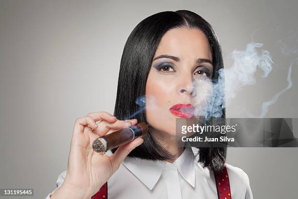 woman smoking a cigar, portrait - beautiful women smoking cigars fotografías e imágenes de stock