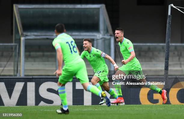 Sergej Milinkovic-Savic of S.S. Lazio celebrates with Ciro Immobile after scoring their side's first goal during the Serie A match between Hellas...