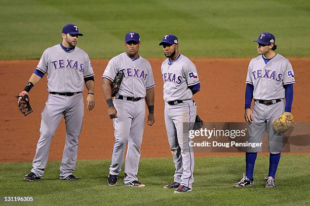 Mitch Moreland, Adrian Beltre, Elvis Andrus and Ian Kinsler of the Texas Rangers stand on the field during Game Six of the MLB World Series against...