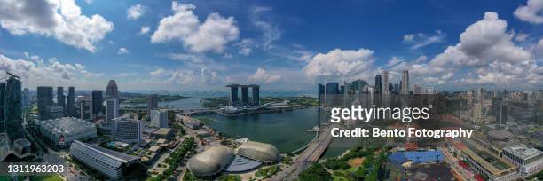 panoramic aerial view of marina bay and singapore city in nice clear sky, singapore - 360 stock pictures, royalty-free photos & images