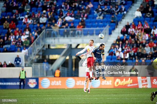 Cup Playoffs: Los Angeles Galaxy Landon Donovan in action, head ball vs New York Red Bulls Teemu Tainio at Red Bull Arena. Leg 1. Harrison, NJ...