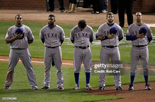 Nelson Cruz, Elvis Andrus, Ian Kinsler, Mitch Moreland and David Murphy of the Texas Rangers stand on the field during Game Six of the MLB World...