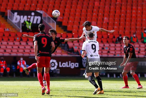 Gabriel Paulista of Valencia CF scores their team's second goal during the La Liga Santander match between Valencia CF and Real Sociedad at Estadio...