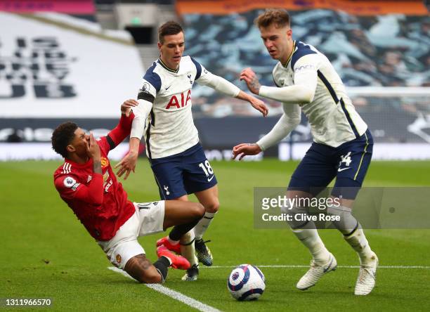 Marcus Rashford of Manchester United is challenged by Giovani Lo Celso of Tottenham Hotspur as Joe Rodon gains possession during the Premier League...