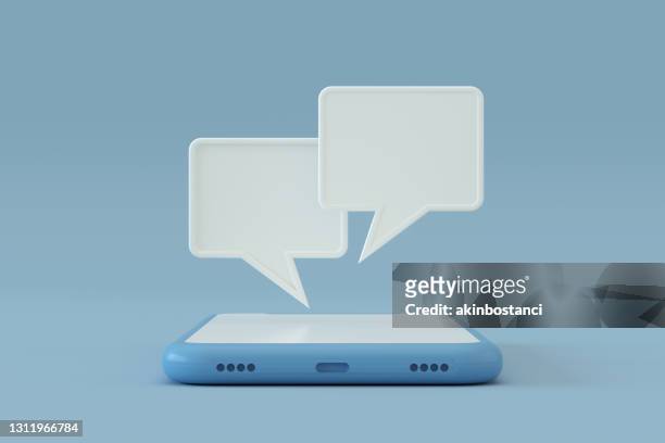 chat speech bubble on smart phone screen - social media stock pictures, royalty-free photos & images
