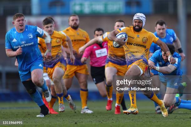 Tom O'Flaherty of Exeter is held up by Robbie Henshaw of Leinster during the Heineken Champions Cup Quarter Final match between Exeter Chiefs and...