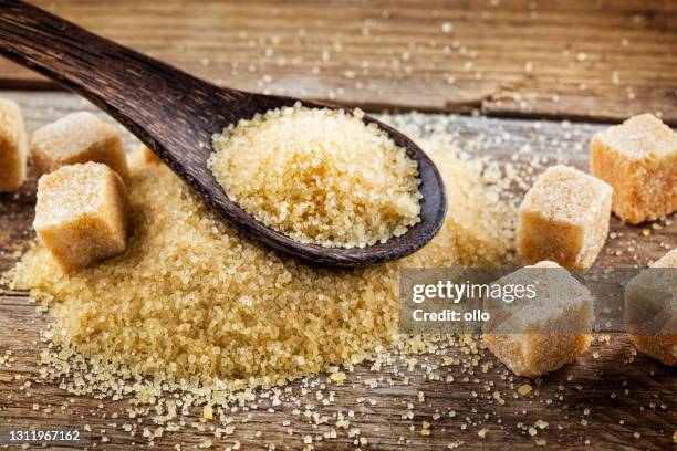 brown sugar and sugar cubes - molasses stock pictures, royalty-free photos & images