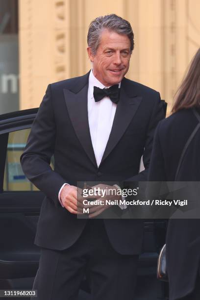 Awards Presenter Hugh Grant seen arriving at the EE British Academy Film Awards 2021 at the Royal Albert Hall on April 11, 2021 in London, England.