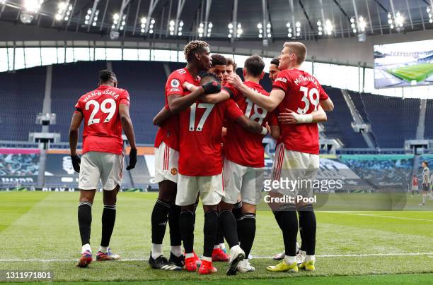 Fred of Manchester United celebrates with Paul Pogba, Bruno Fernandes and Scott McTominay after scoring their team's first goal during the Premier...